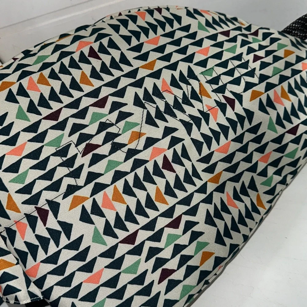 Kavu Geometric Triangle Sling Backpack in Cream, Black, Orange, Green, Navy